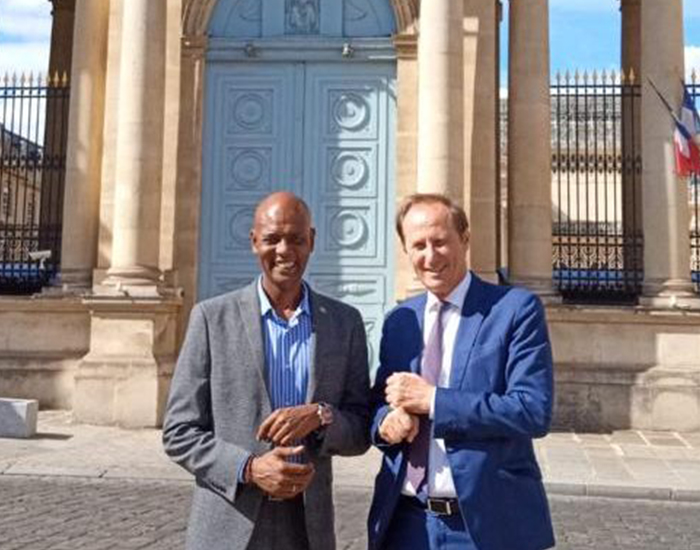 Abshir Aden Ferro with the MP Bruno Fuchs in front of French Parliament building, Paris, France. July 9, 2020.
